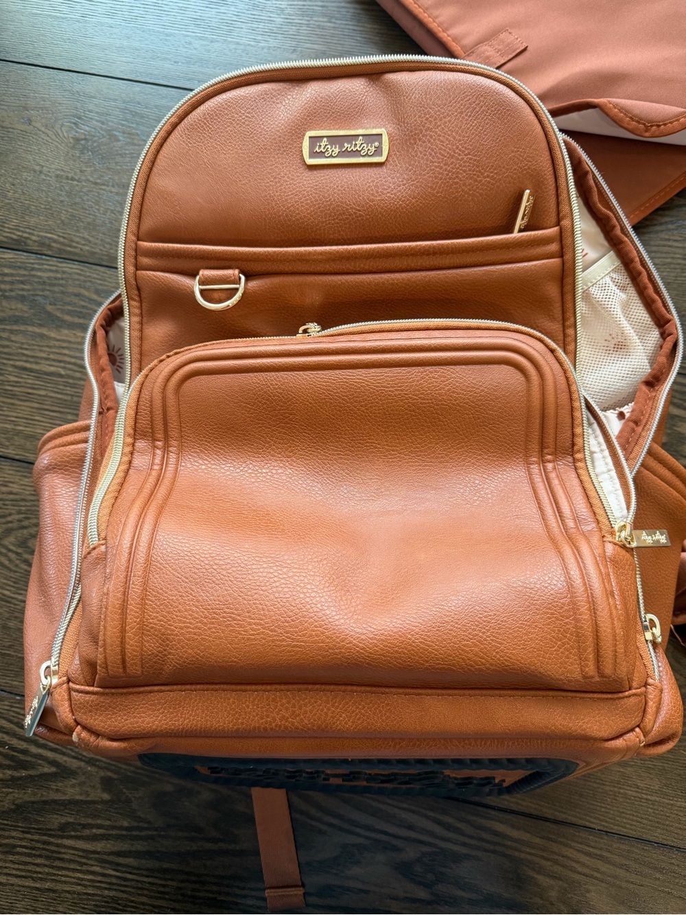 Itzy Ritzy brown Vegan Leather Diaper Backpack with Gold Hardware